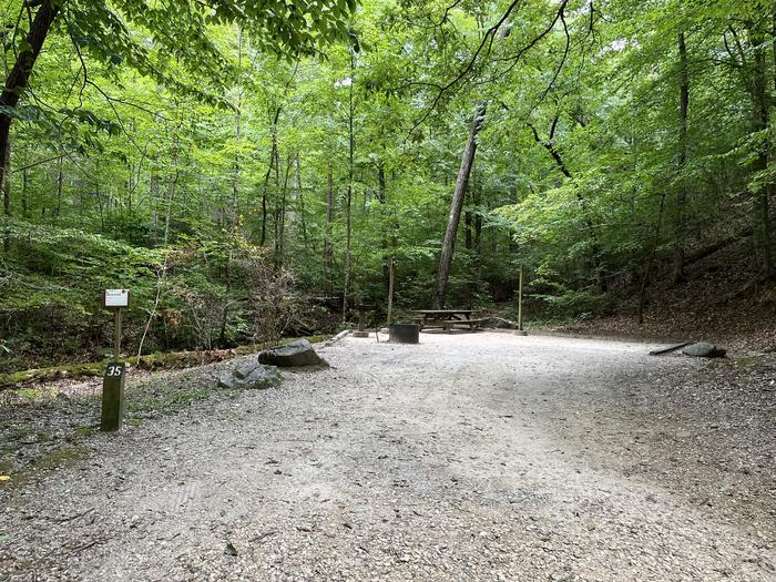 A photo of Site 035 of Loop B at CAVE MOUNTAIN LAKE FAMILY CAMP with Shade, Tent Pad