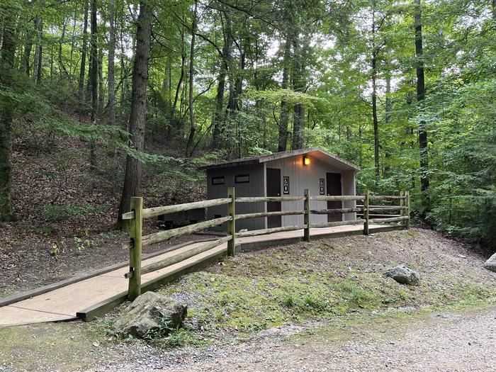 A photo of restroom facilities next to Site 033 of Loop B at CAVE MOUNTAIN LAKE FAMILY CAMP