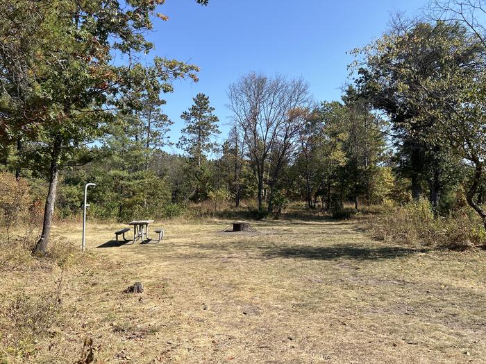 Campfire ring, picnic table, and lantern post in campsite 2Campfire ring, picnic table, and lantern post in campsite 52