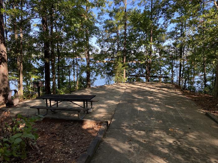 A photo of Site 073 of Loop LOOE at R SHAEFER HEARD with Picnic Table, Electricity Hookup, Fire Pit, Shade, Waterfront, Lantern Pole