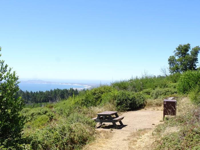 Campsite with picnic table, food storage lockerSky 4