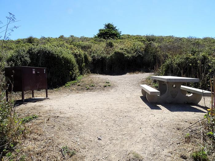 Campsite with picnic table and food storage locker.Coast 2