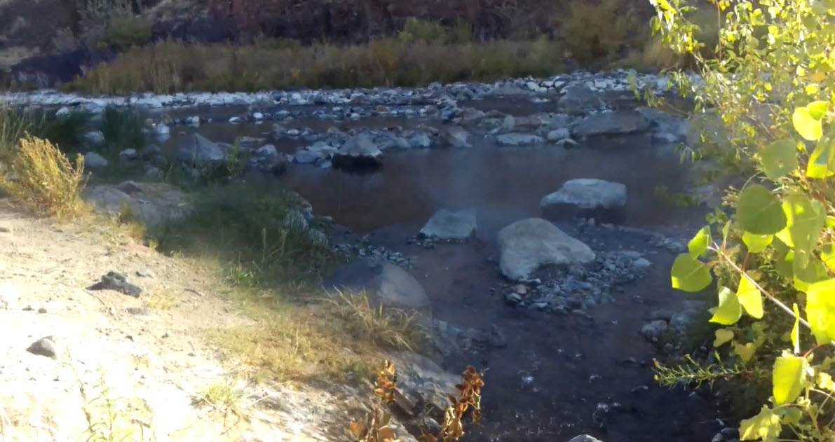 Steam rises from Snively Hot Springs