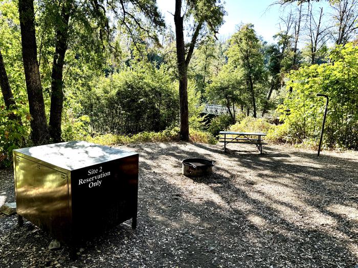 A photo of Site 02 of Loop PELTIER BRIDGE PRIMITIVE CAMPGROUND at PELTIER BRIDGE PRIMITIVE CAMPGROUND with Picnic Table, Fire Pit, Shade, Food Storage, Lantern Pole