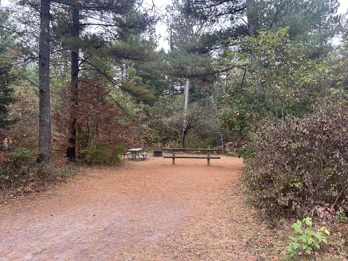 Campfire ring, picnic table, and lantern post in campsite 4