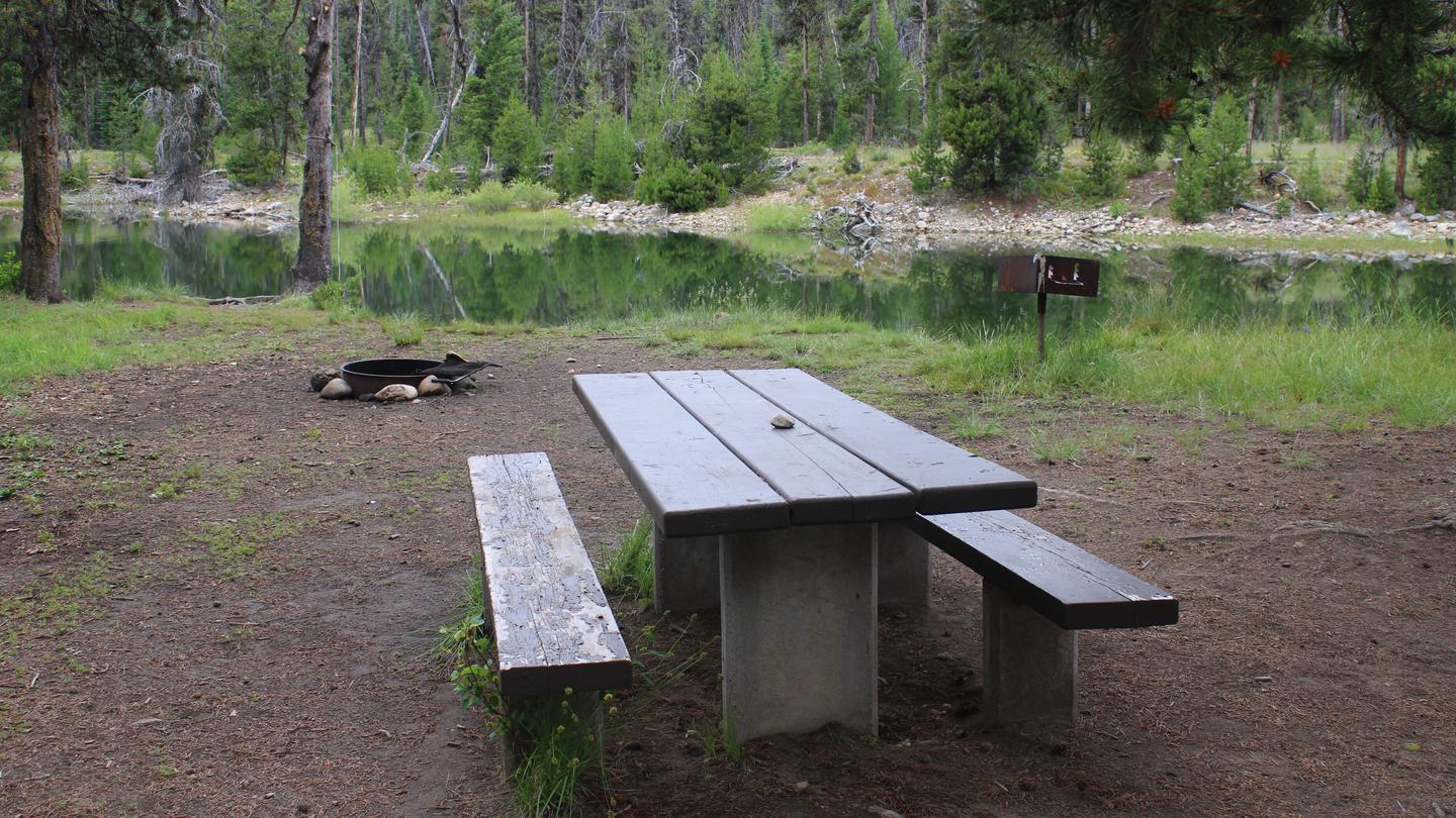 Picnic table with view of Deadwood RiverRiver Side campground campsite