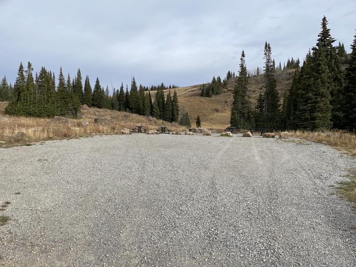 A photo of Site 15 at Deep Lake Campground with Picnic Table, Fire Pit, Tent Pad