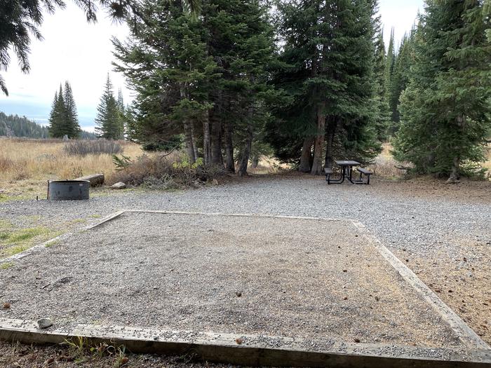 A photo of Site 25 at Deep Lake Campground with Picnic Table, Fire Pit, Shade, Tent Pad