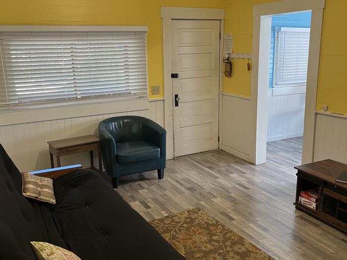 Main Entrance through front door. Updated flooring, wall paint and new end tables.