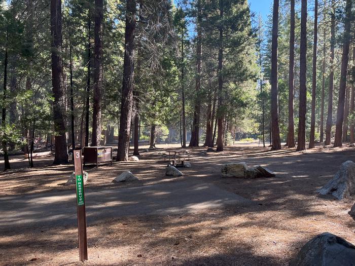 Scene showing full campsite, parking pad and post with the number 3 on itSite #3 Parking Pad