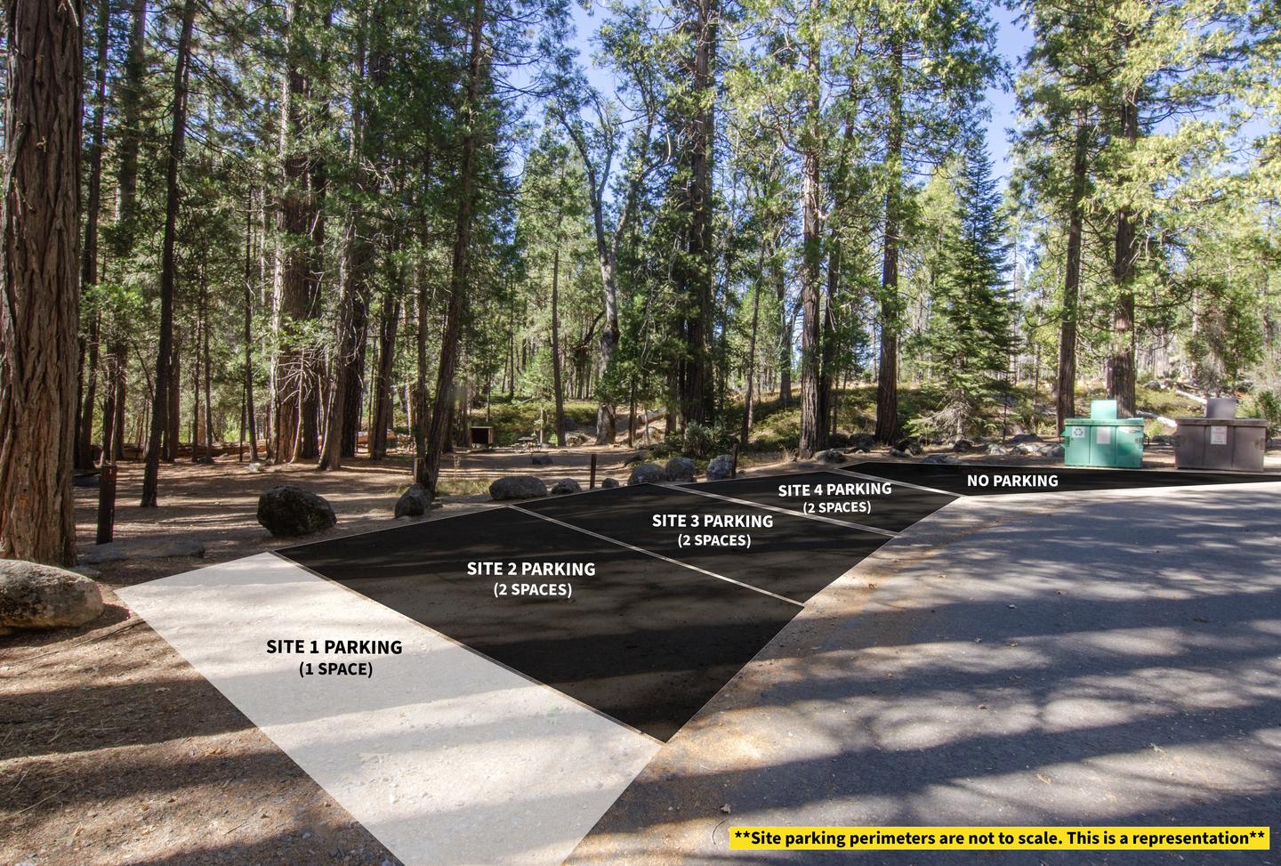 Large dirt parking area on the left side of a paved road. It is bordered by boulders and a trash/recycling bin.Parking spot #2 for camp site 01. It is shared parking with sites 02, 03, and 04.