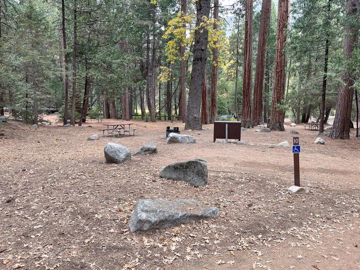 Scene showing full accessible campsite, parking pad and post with the number 10 on itADA Site #10 Parking Pad
