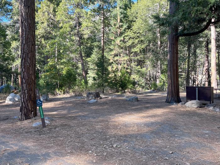 Scene showing accessible full campsite, parking pad and post with the number 14 on itADA Site #14 Parking Pad
