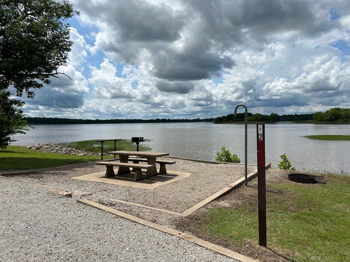 Site 2 is located along the roadway of the main road. Parking is parallel to the site.Site 2 overlooks Heyburn Lake with a shoreline front.