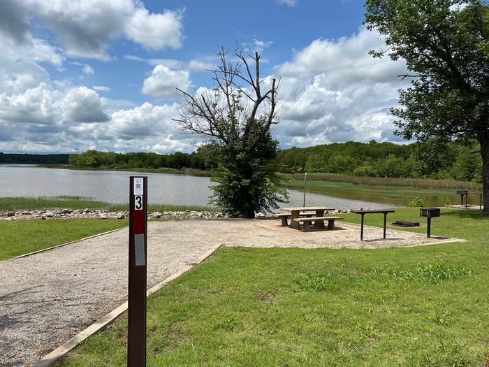 Site 3 with picnic table, lantern pole, fire ring, and grill.Site 3 overlooks Heyburn Lake with shoreline access.