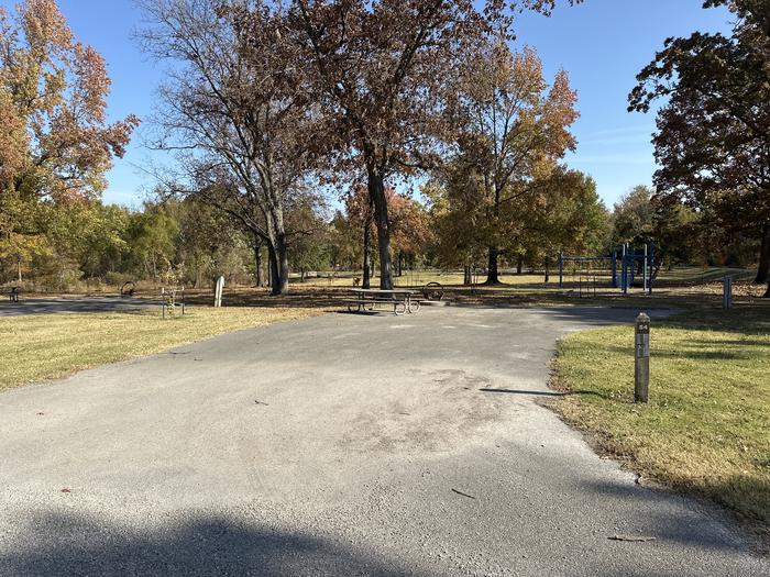 A photo of Site 054 of Loop L3 at Coles Creek Campground with Electricity Hookup, Fire Pit