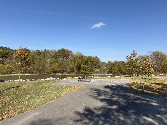 A photo of Site 018 of Loop L1 at Coles Creek Campground with Picnic Table, Electricity Hookup, Fire Pit