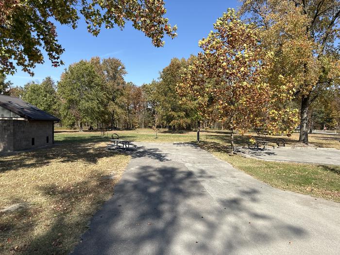 A photo of Site 004 of Loop L1 at Coles Creek Campground with Picnic Table, Electricity Hookup, Fire Pit