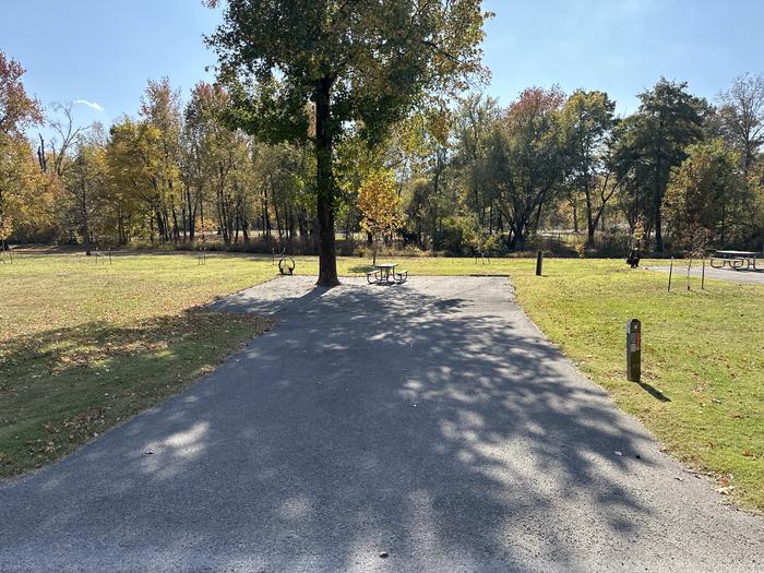 A photo of Site 003 of Loop L1 at Coles Creek Campground with Picnic Table, Electricity Hookup, Fire Pit