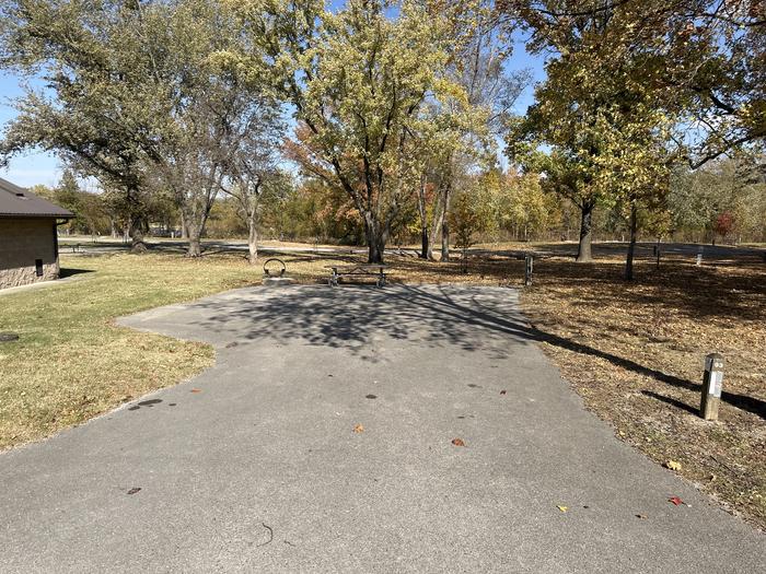 A photo of Site 093 of Loop L4 at Coles Creek Campground with Picnic Table, Electricity Hookup, Fire Pit