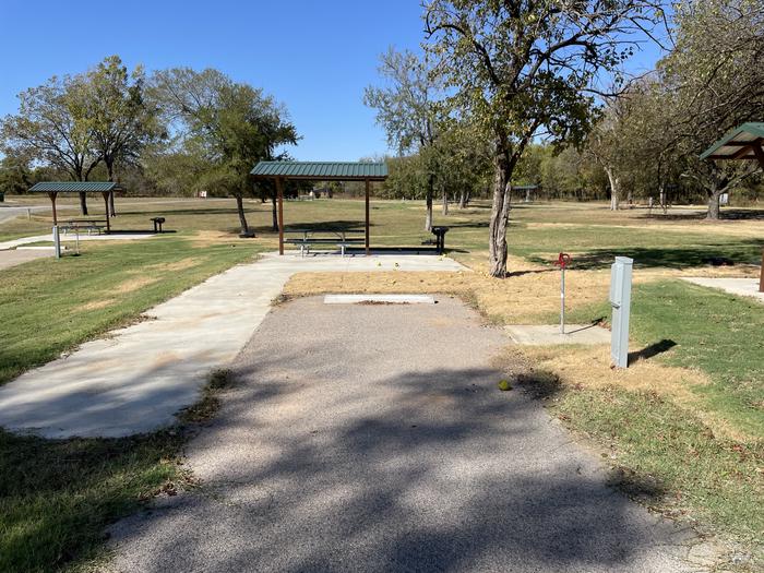 A photo of Site D08 of Loop D at LAKESIDE (OK) with Picnic Table, Electricity Hookup, Fire Pit, Shade, Water Hookup