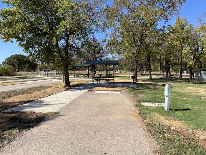 A photo of Site D14 of Loop D at LAKESIDE (OK) with Picnic Table, Electricity Hookup, Fire Pit, Shade, Water Hookup