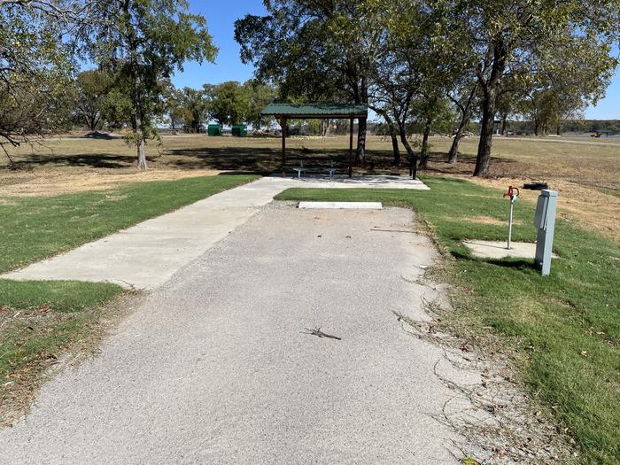 A photo of Site D18 of Loop D at LAKESIDE (OK) with Picnic Table, Electricity Hookup, Fire Pit, Shade, Water Hookup