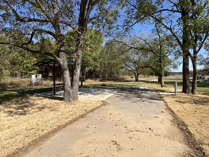 A photo of Site D26 of Loop D at LAKESIDE (OK) with Picnic Table, Electricity Hookup, Fire Pit, Shade, Water Hookup