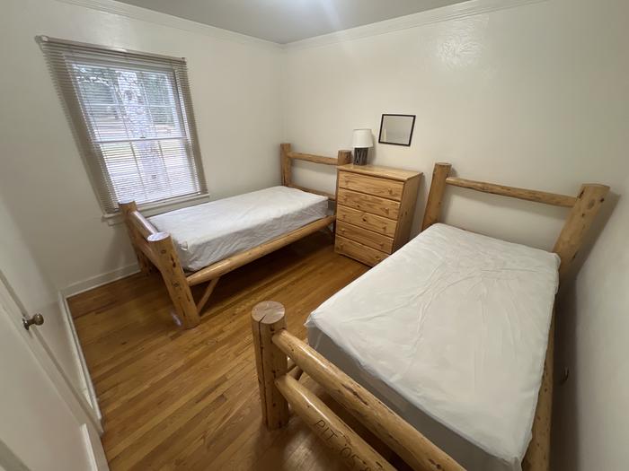 Savenac West Cottage bedroom with 2 twin XL beds. 