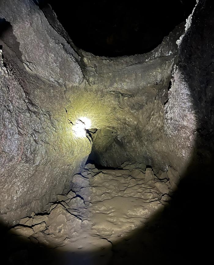 Inside cave, tube in tubeVaried terrain. Expect a rocky and sandy trail. 