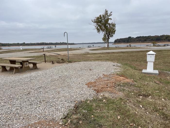 A photo of Site 18 of Loop Appalachia Bay at Appalachia Bay Recreation Area with Boat Ramp, Picnic Table, Electricity Hookup, Fire Pit, Lantern Pole, Water Hookup