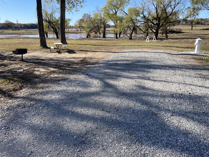 A photo of Site 23 of Loop Appalachia Bay at Appalachia Bay Recreation Area with Boat Ramp, Picnic Table, Electricity Hookup, Shade, Water Hookup