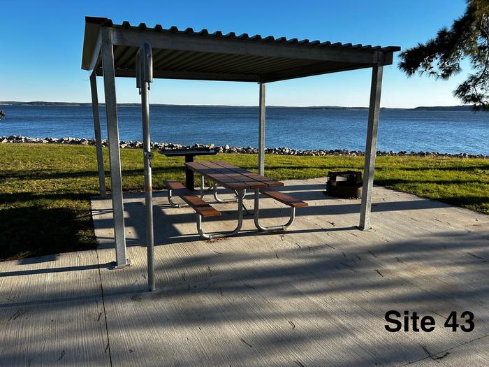 A photo of Site 43 of Loop LOOB at RAYBURN with Picnic Table, Electricity Hookup, Fire Pit, Shade, Waterfront, Lantern Pole, Water Hookup