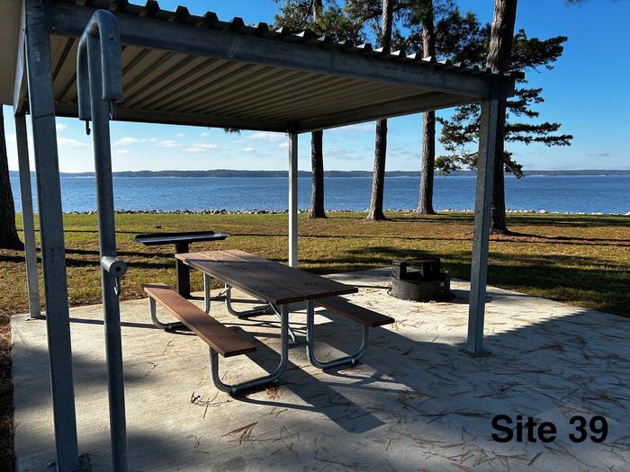 Amenities include; power pedestal 50/30/30 amp, water hookup, shelter, lantern post, picnic table, grill stand, fire ring with grill, level concrete pad.