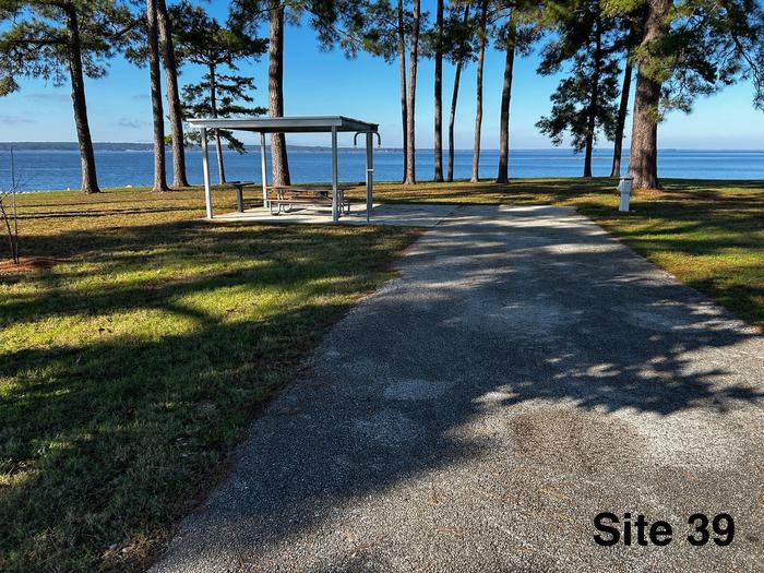 Amenities include; power pedestal 50/30/30 amp, water hookup, shelter, lantern post, picnic table, grill stand, fire ring with grill, level concrete pad.