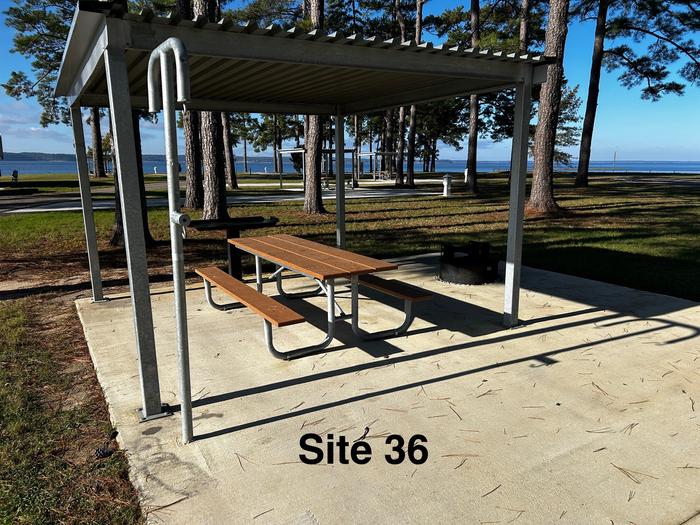 Amenities include; power pedestal 50/30/30 amp, water hookup, shelter, lantern post, picnic table, grill stand, fire ring with grill, level concrete pad.