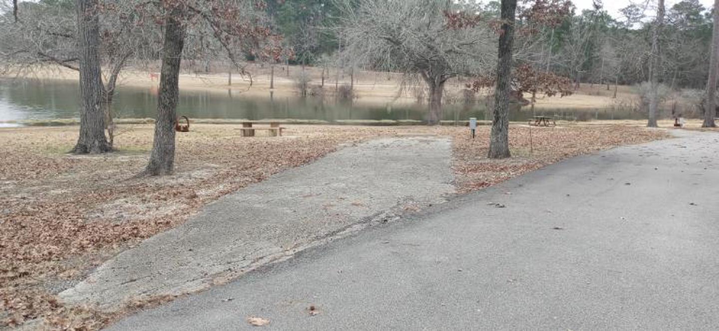 A photo of Site 40 of Loop LOOC at SAN AUGUSTINE with Waterfront, Electricity Hookup, Water Hookup, Picnic Table, Fire Pit, Shade