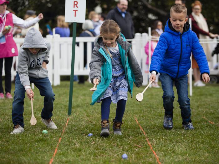 Children participating in the White House Easter Egg Roll, on the South Lawn of the White House. 