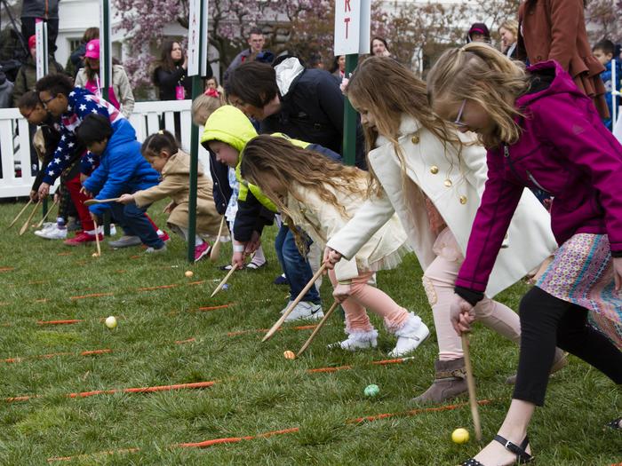 Children at the start line getting ready to roll eggs at the White House Easter Egg Roll event