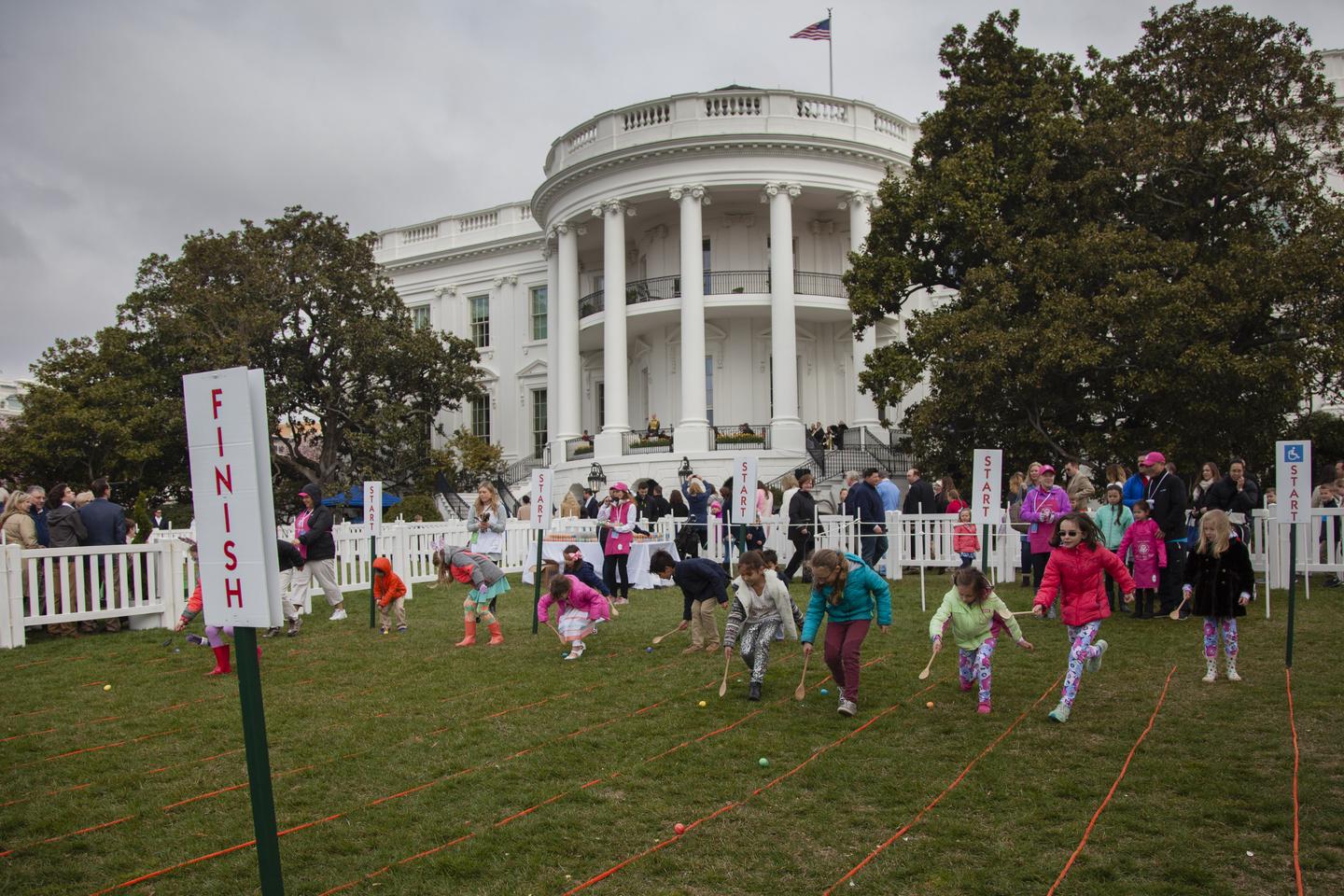 Children participating in the White House Easter Egg Roll, on the White House lawn. 