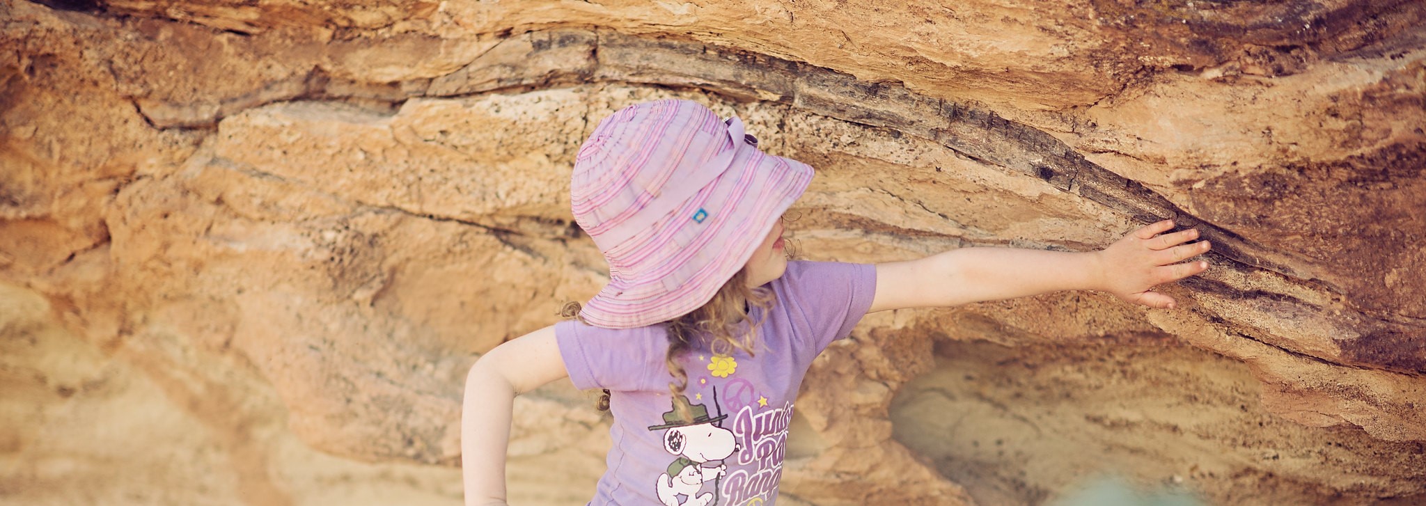 child viewing dinosaur bone at Mill Canyon Dinosaur Bone Site