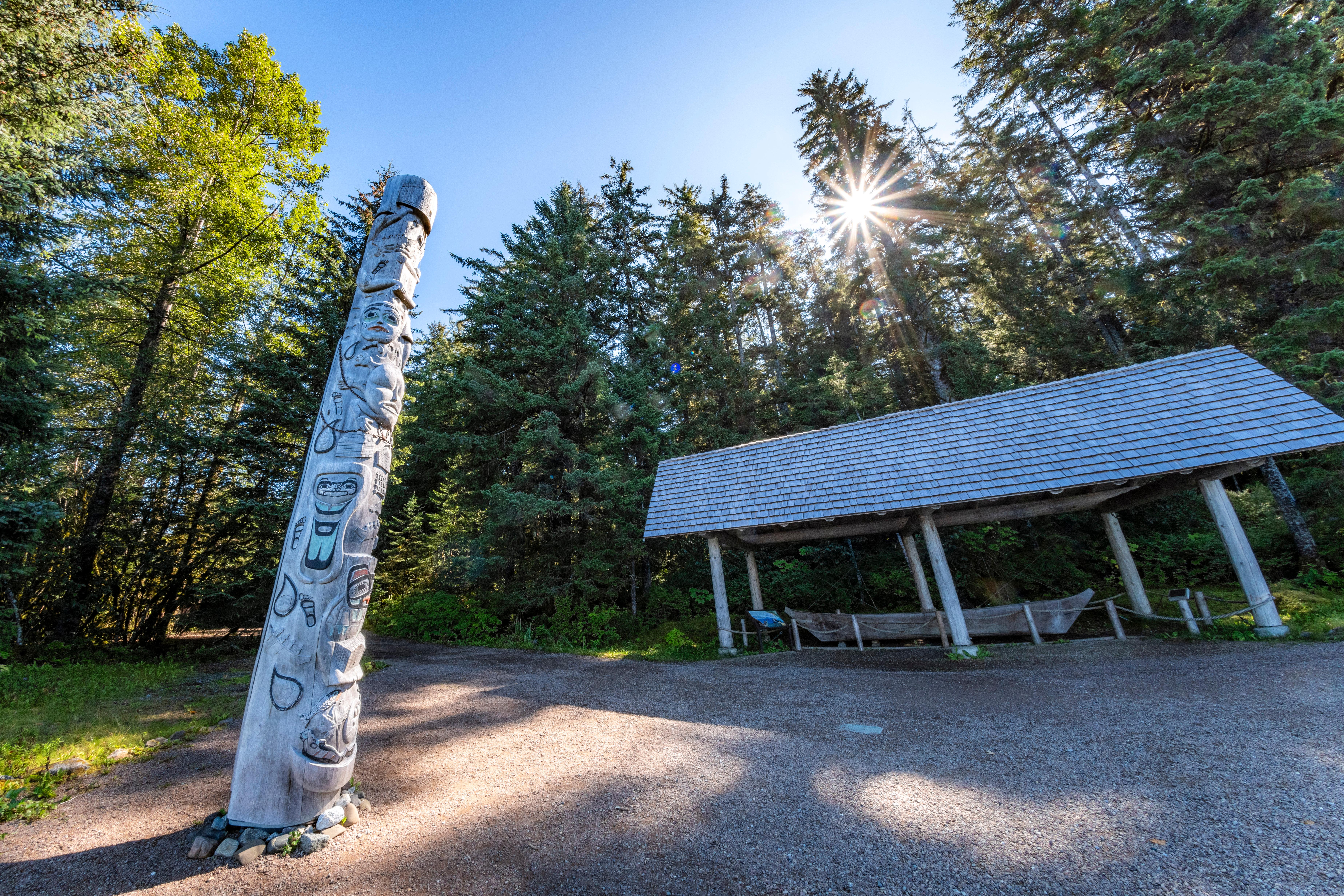 The Healing Totem Pole and Dugout Canoe Shelter outside the VIS