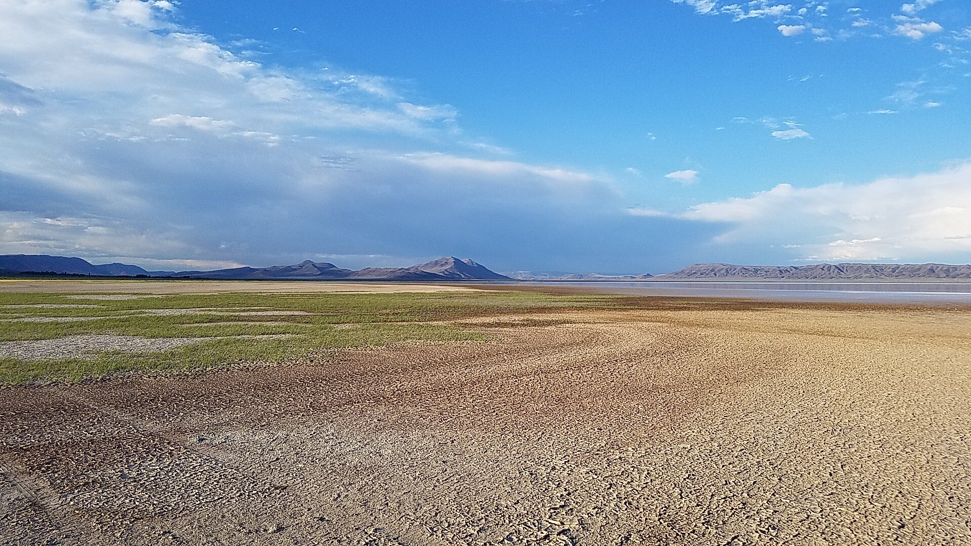 Vast playa landscape of the Alvord Desert facing toward mountains
