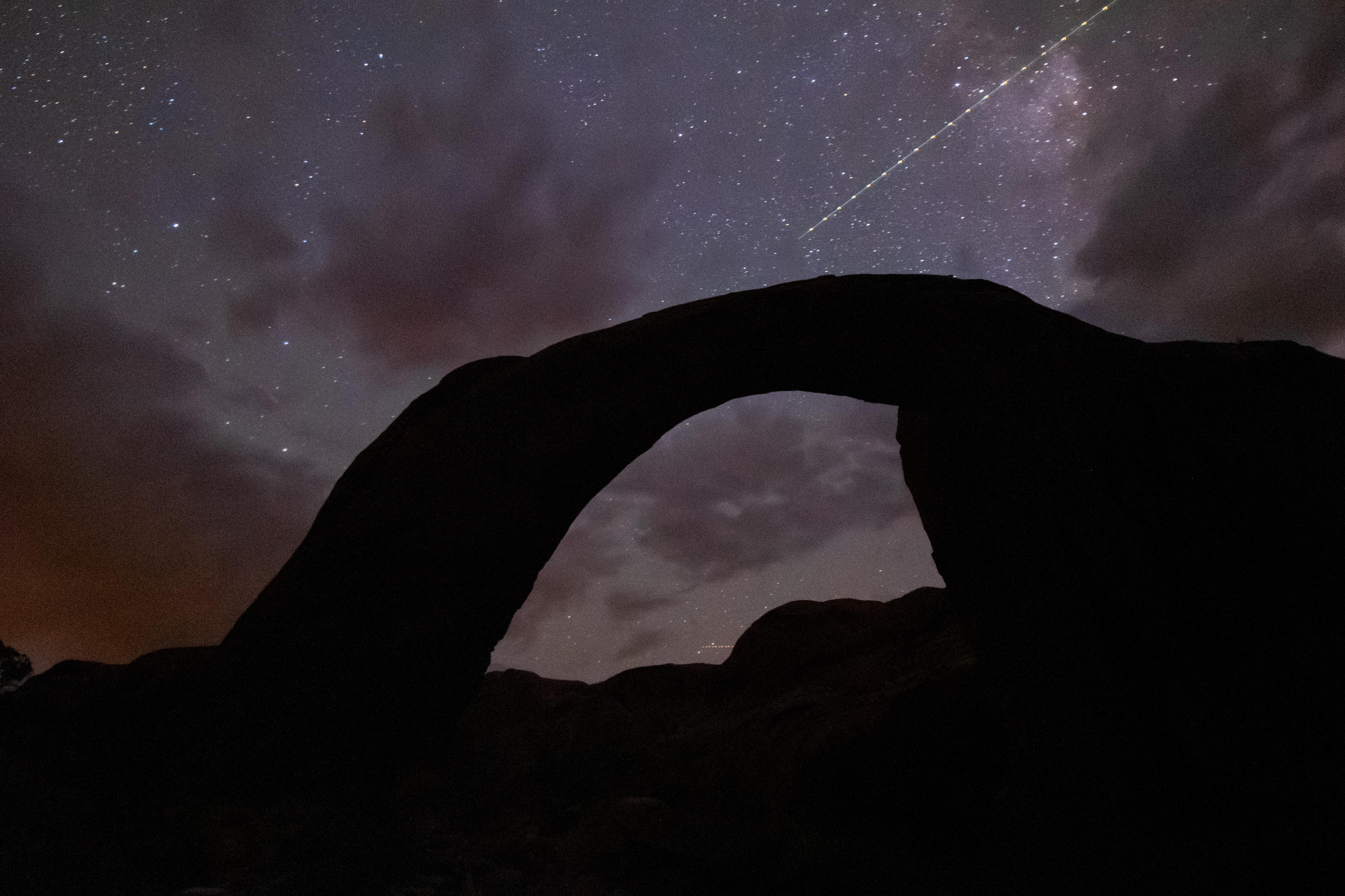 Rainbow Bridge Under Starry Skies
