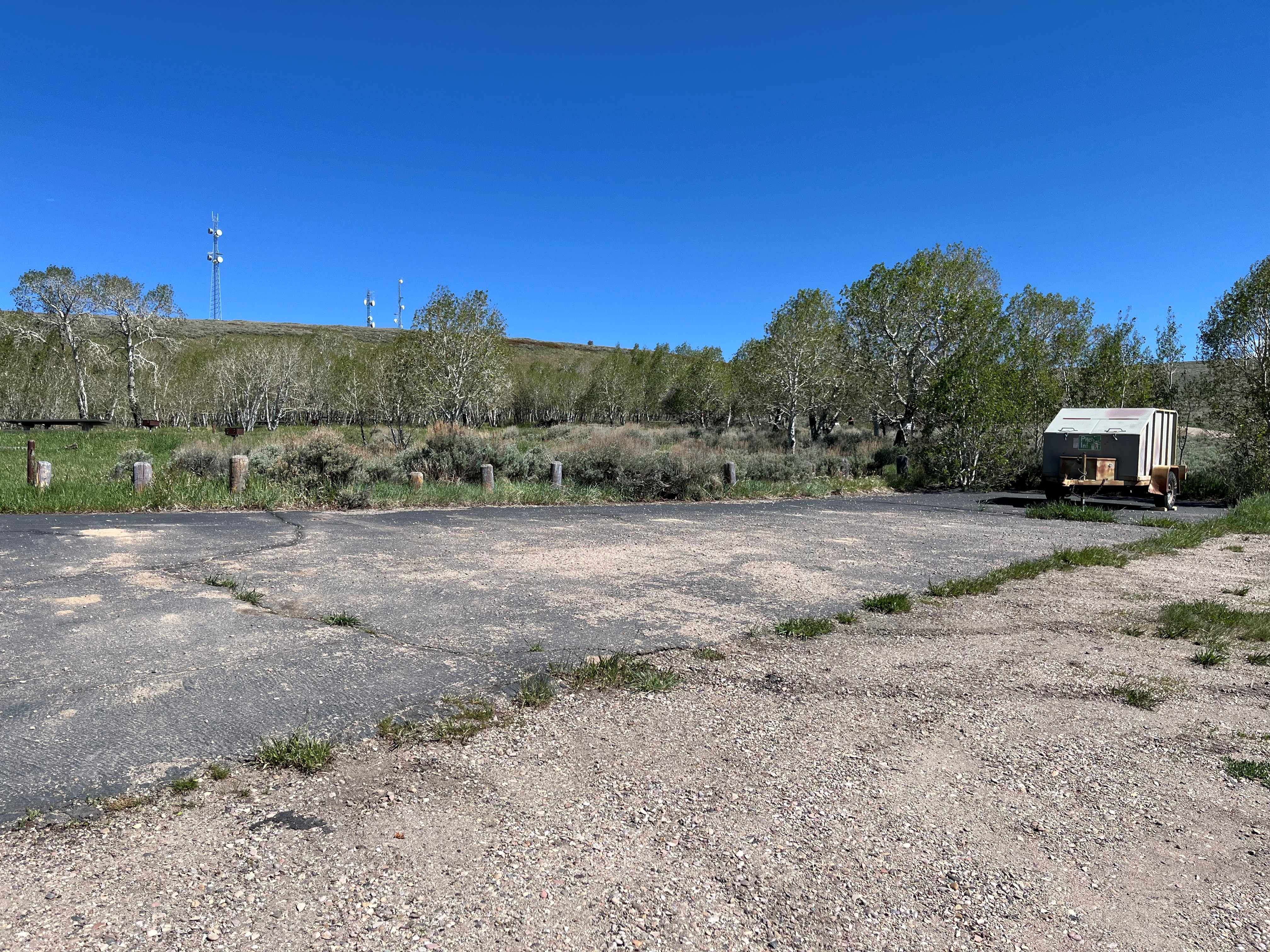 Lower parking area with trash bin
