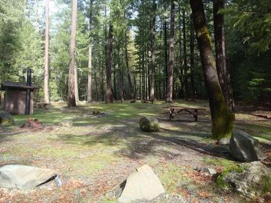 Fir Cove Campground CampsitesLarge partially shaded campsites with vault toilets, picnic tables and fire rings. 
