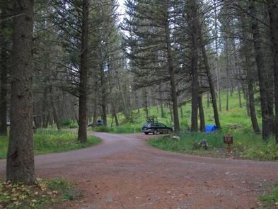 CABIN CREEK CAMPGROUND road and campsite with vehicle & tentCabin Creek Campground