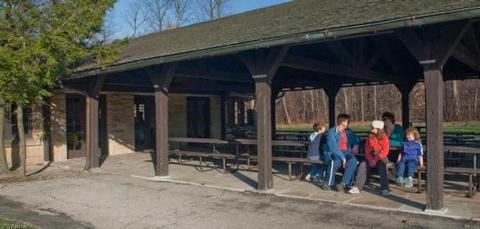 Visitors seated at a picnic table at the Ledges