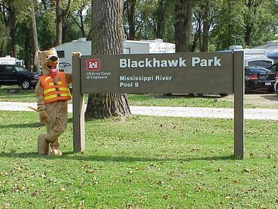 Blackhawk Park sign with Bobber the Water Safety DogBobber the Water Safety Dog and Park Sign
