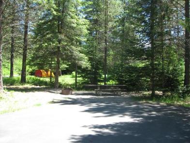 SWAN LAKE CAMPGROUND SiteTent, picnic table and fire ring. 